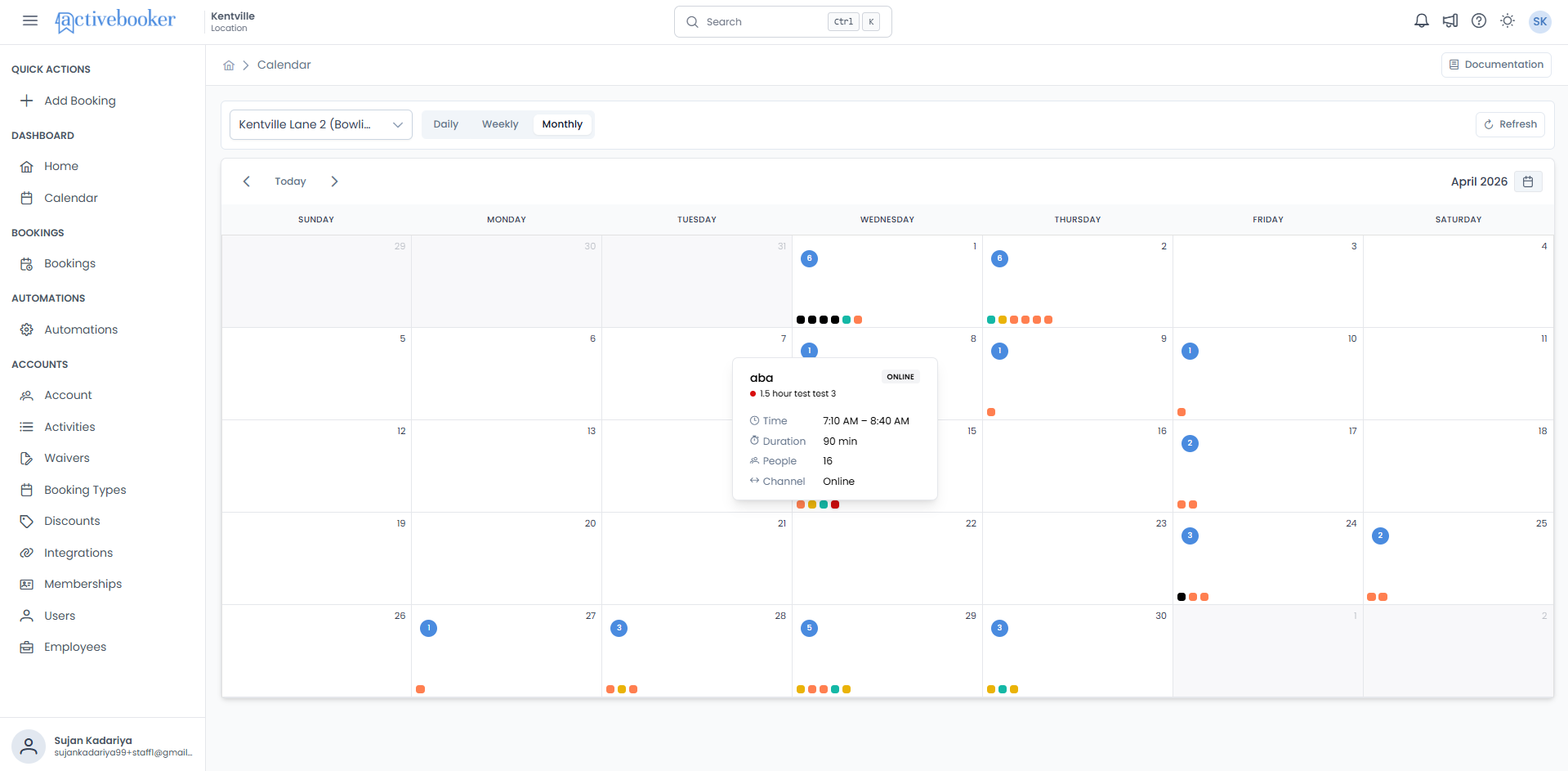 Booking tooltip displayed on hover in the Monthly view showing customer name, booking type, time, duration, people, and channel